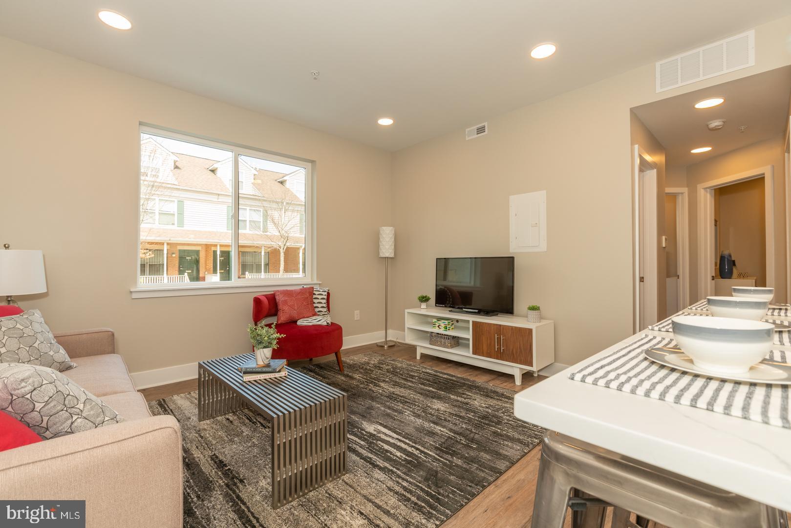 2220-28 Master Street, Unit 1 Philadelphia, PA 19121 - Photo 4 of 14 a living room with furniture and a flat screen tv