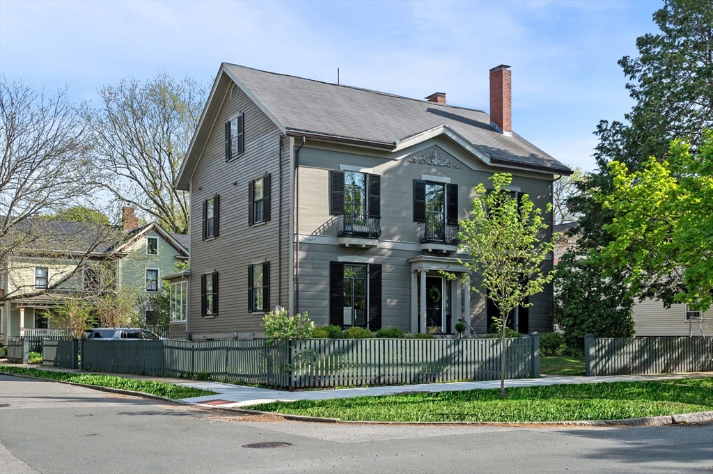31 Broad Street Salem, MA 01970 - Photo 1 of 39 a front view of a house with a garden