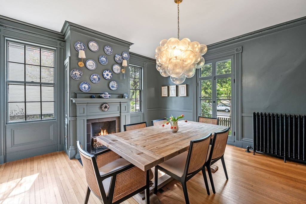 31 Broad Street Salem, MA 01970 - Photo 14 of 39 a view of a dining room with furniture a chandelier and wooden floor