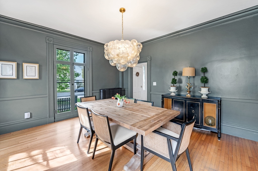 31 Broad Street Salem, MA 01970 - Photo 15 of 39 a view of a dining room with furniture window and wooden floor