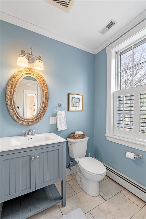31 Broad Street Salem, MA 01970 - Photo 28 of 39 a bathroom with a toilet a sink and a mirror