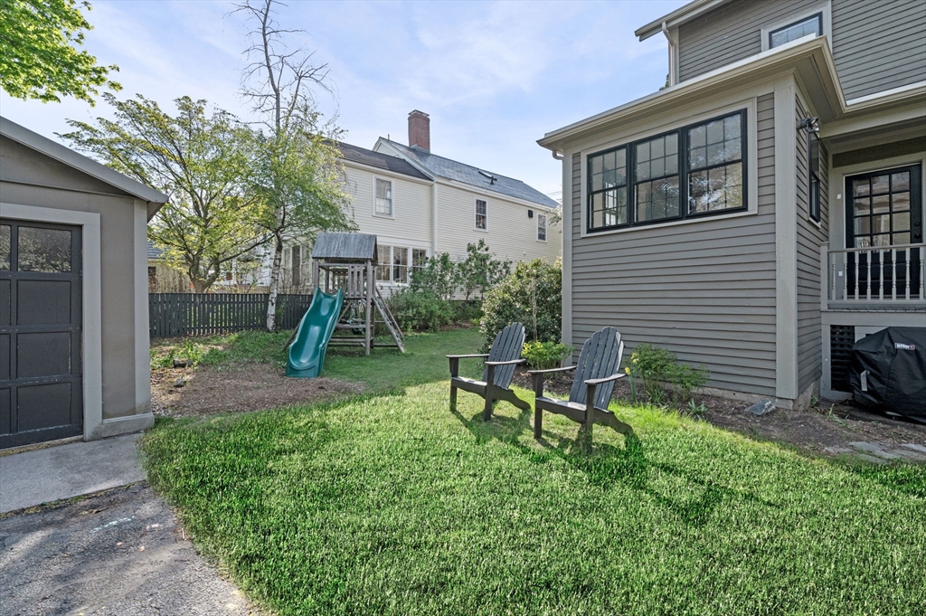 31 Broad Street Salem, MA 01970 - Photo 4 of 39 a view of a house with backyard and a slide