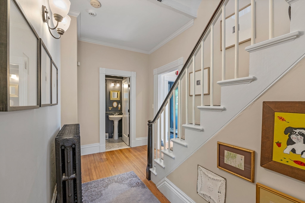 31 Broad Street Salem, MA 01970 - Photo 8 of 39 a view of entryway and hall with wooden floor