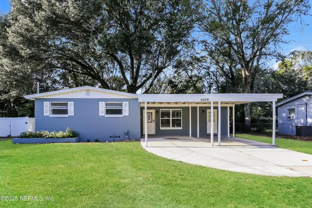 front view of a house with a yard