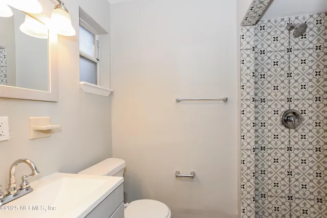 a bathroom with a toilet and sink