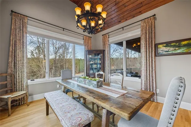 a balcony view with a seating space and a potted plant