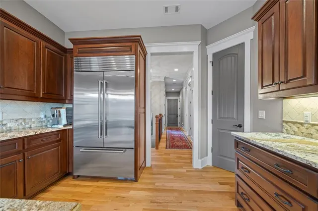 a outdoor view with a sitting space and large trees