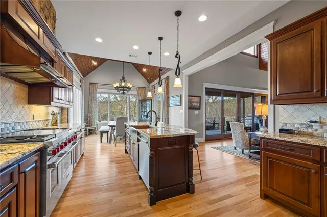 a en suite bathroom with a granite countertop sink and a mirror
