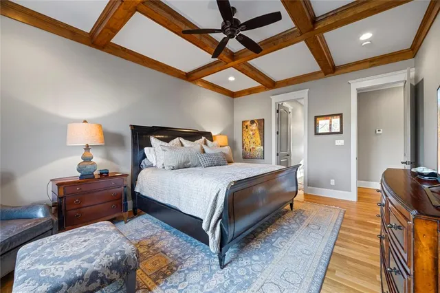 a en suite bathroom with a granite countertop sink and a mirror