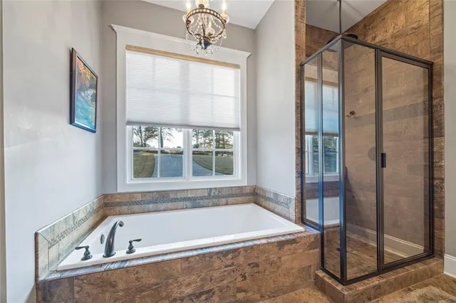 a bedroom with a bed and a bathroom