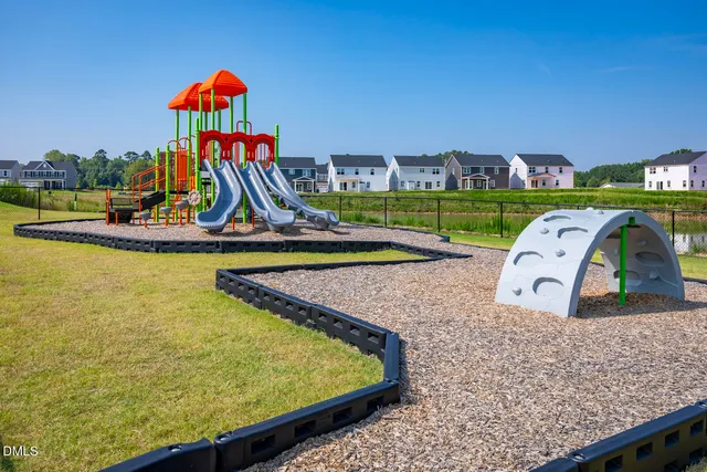 a view of swimming pool with a outdoor seating