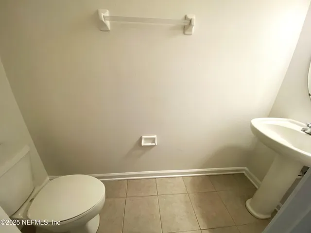 a bathroom with a toilet and a sink