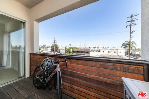 a view of a balcony chairs and wooden floor