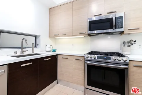 a kitchen with a stove and a microwave