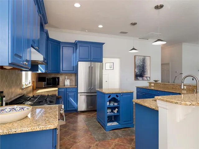 an aerial view of a house with swimming pool patio and outdoor seating