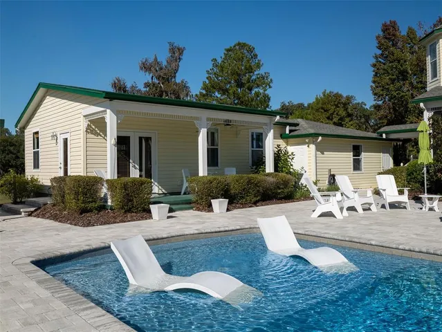 a view of a house with a yard and garage