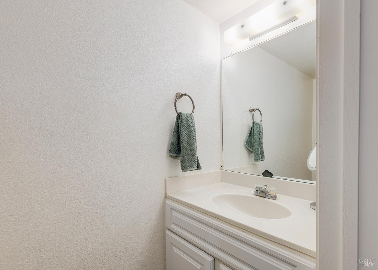 668 Racquet Club Circle Rohnert Park, CA 94928 - Photo 13 of 28 a bathroom with a sink and a mirror