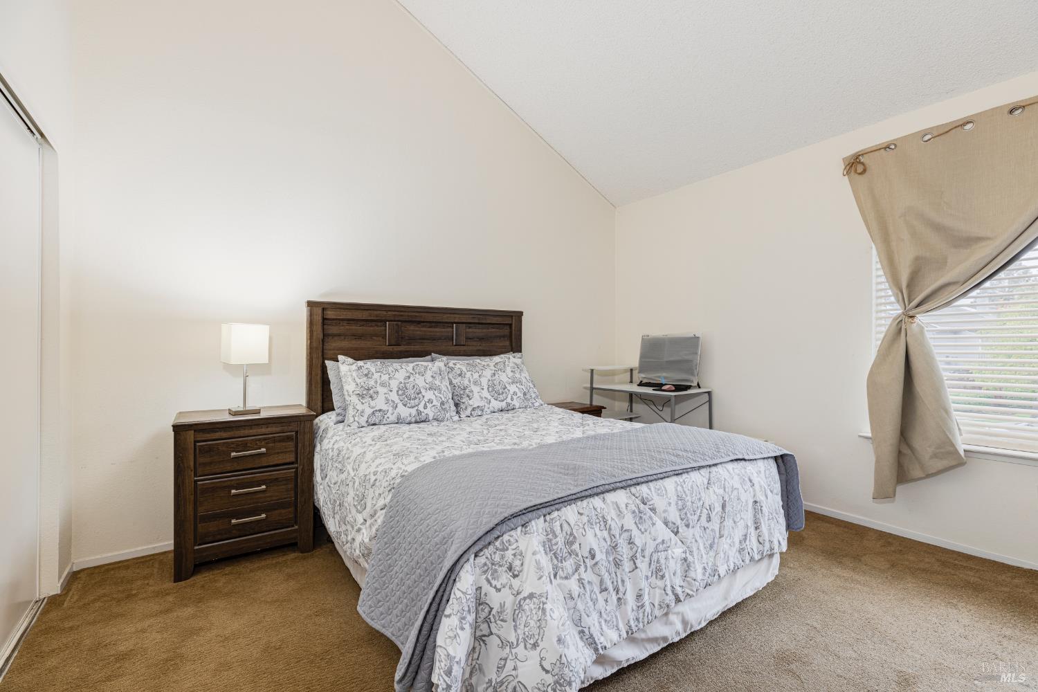 668 Racquet Club Circle Rohnert Park, CA 94928 - Photo 18 of 28 a bedroom with a bed and a night stand