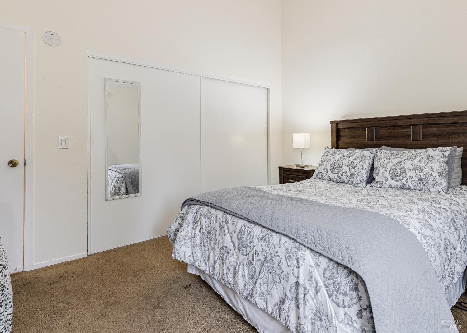 668 Racquet Club Circle Rohnert Park, CA 94928 - Photo 19 of 28 a bedroom with a bed and a night stand