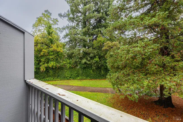 a view of a garden from a balcony