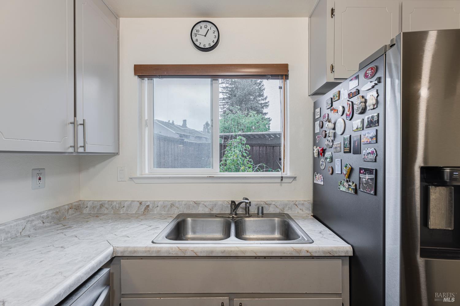 668 Racquet Club Circle Rohnert Park, CA 94928 - Photo 9 of 28 a kitchen with a refrigerator and a sink