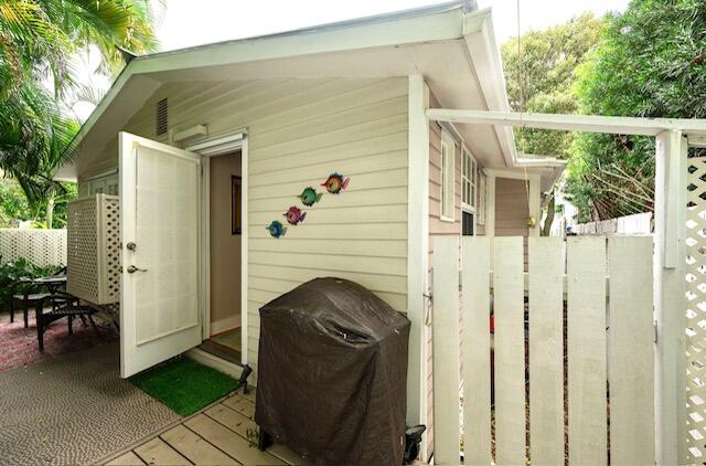 1218 Packer Street, Unit REAR Key West, FL 33040 - Photo 22 of 22 a view of a balcony with furniture