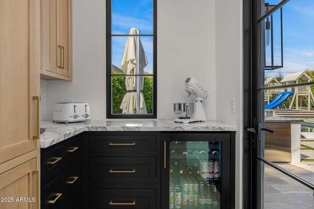 a spacious bathroom with a granite countertop sink mirror and shower