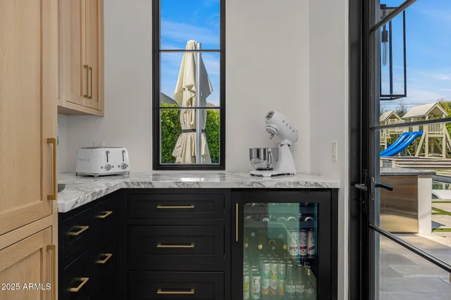 a spacious bathroom with a granite countertop sink mirror and shower