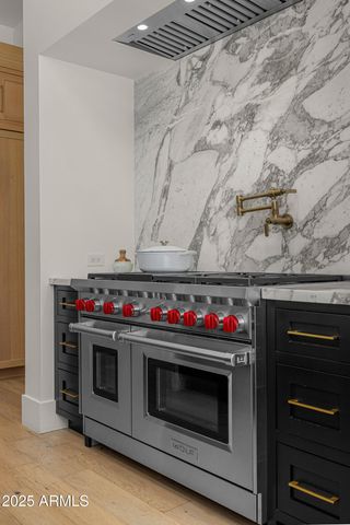 a bathroom with a granite countertop window and a sink