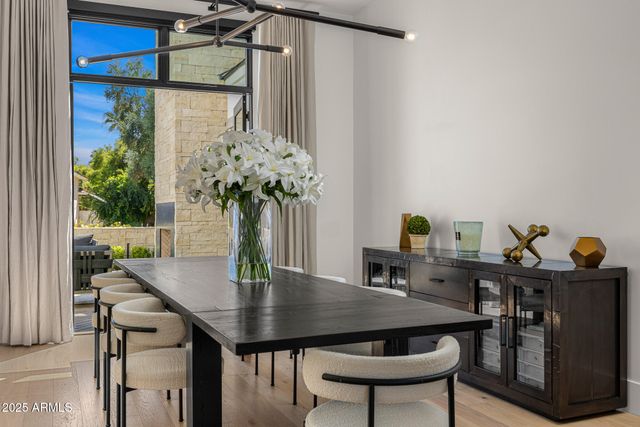 a view of a dining room with furniture window and outside view