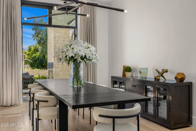 a view of a dining room with furniture window and outside view