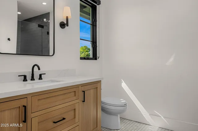 a view of a patio with couches table and chairs with wooden floor and fence
