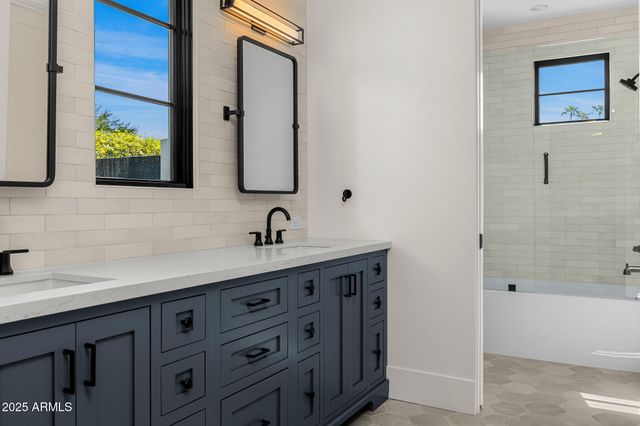 a view of a chairs and table in backyard of the house