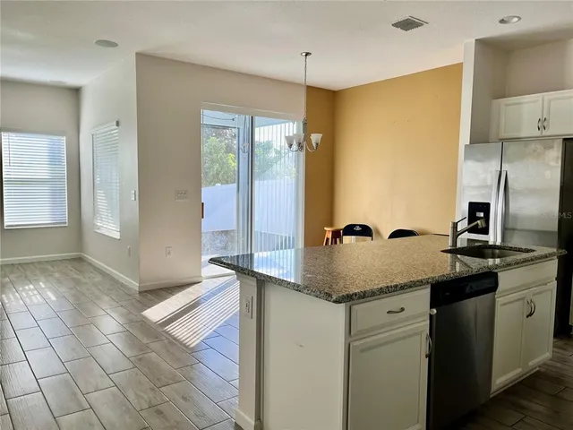 a view of a room with rack on the wall and a window