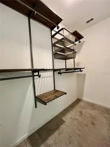 a kitchen with stainless steel appliances granite countertop a refrigerator stove microwave and sink