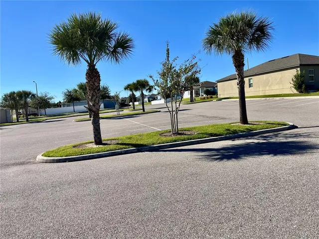 a view of a swimming pool with a patio