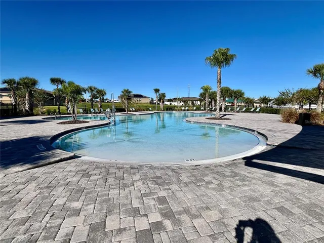 a view of balcony with a table and chairs