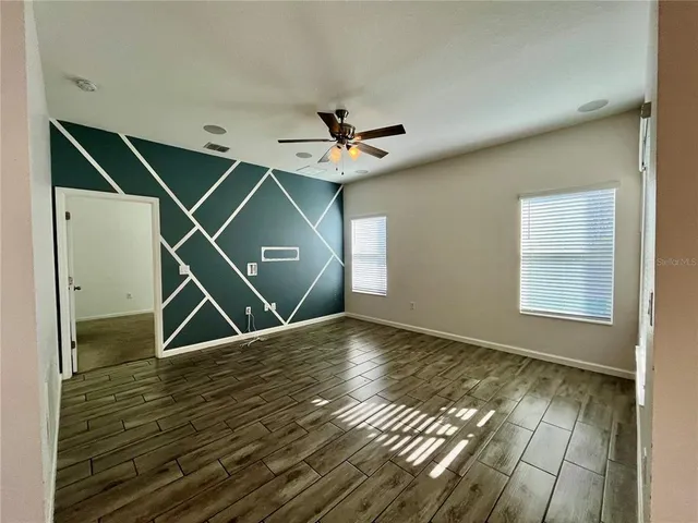 a view of an empty room with a window