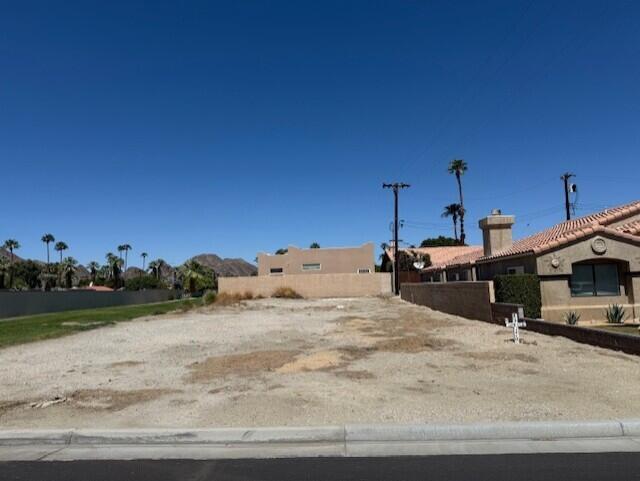 55 Saguaro Road La Quinta, CA 92253 - Photo 2 of 4 a view of a backyard of the house