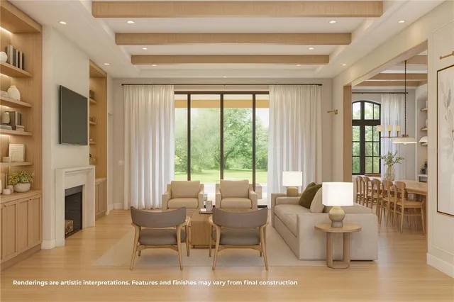 a living room with fireplace furniture and a large window