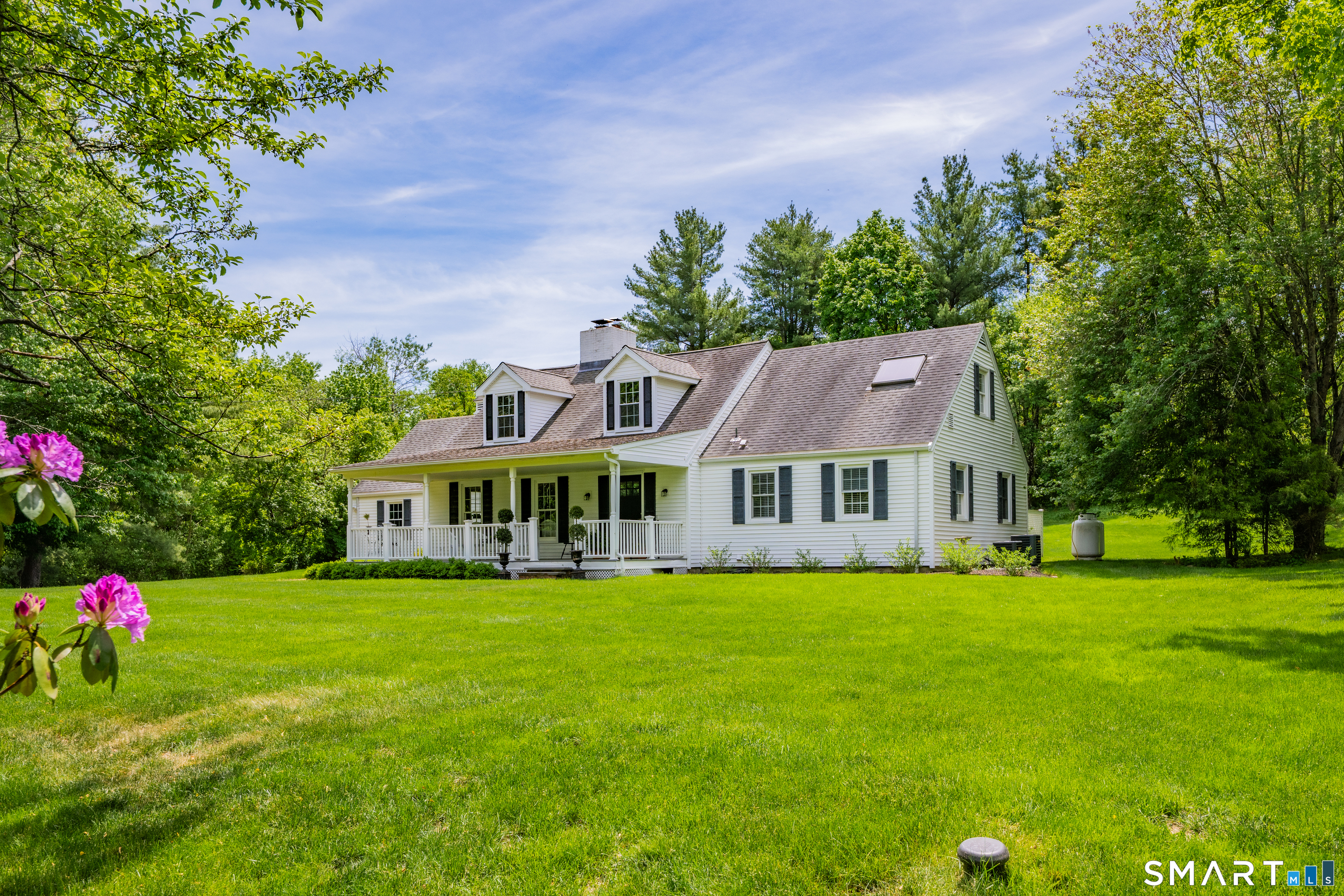 1000 Bassett Road Watertown, CT 06795 - Photo 32 of 35 a front view of a house with garden