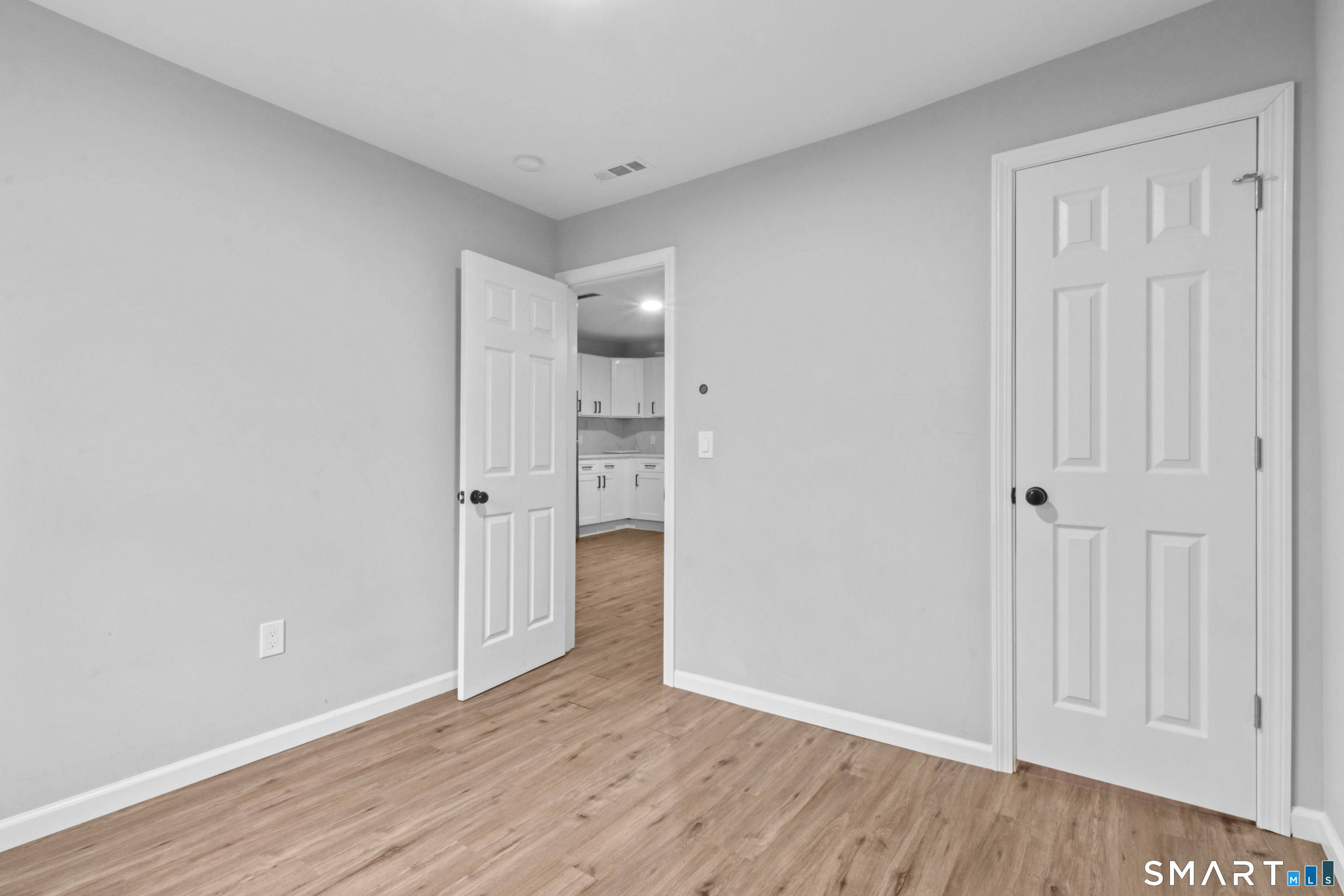 173 Shaw Street New London, CT 06320 - Photo 12 of 19 wooden floor in an empty room