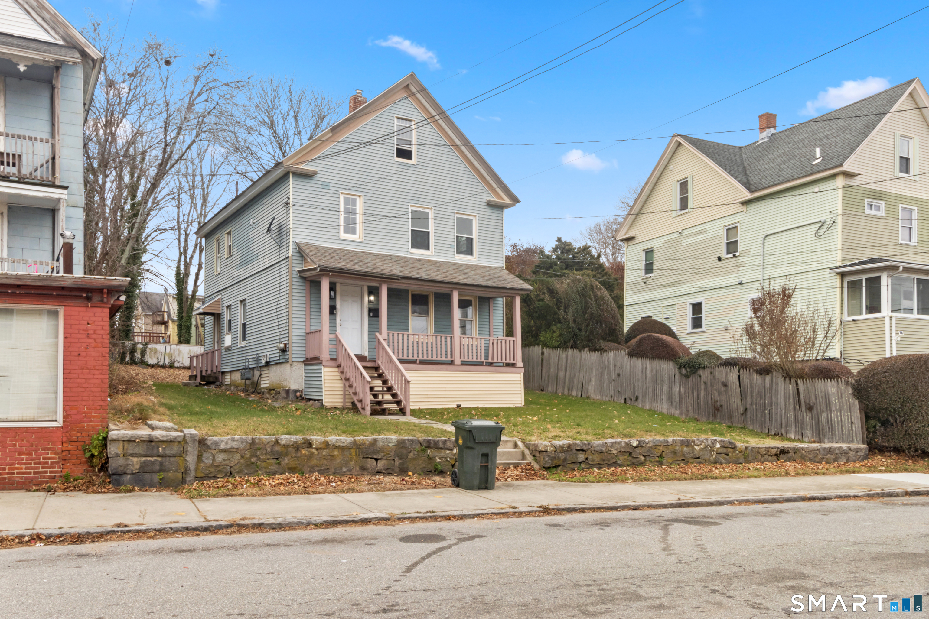 173 Shaw Street New London, CT 06320 - Photo 2 of 19 a front view of a house with a yard