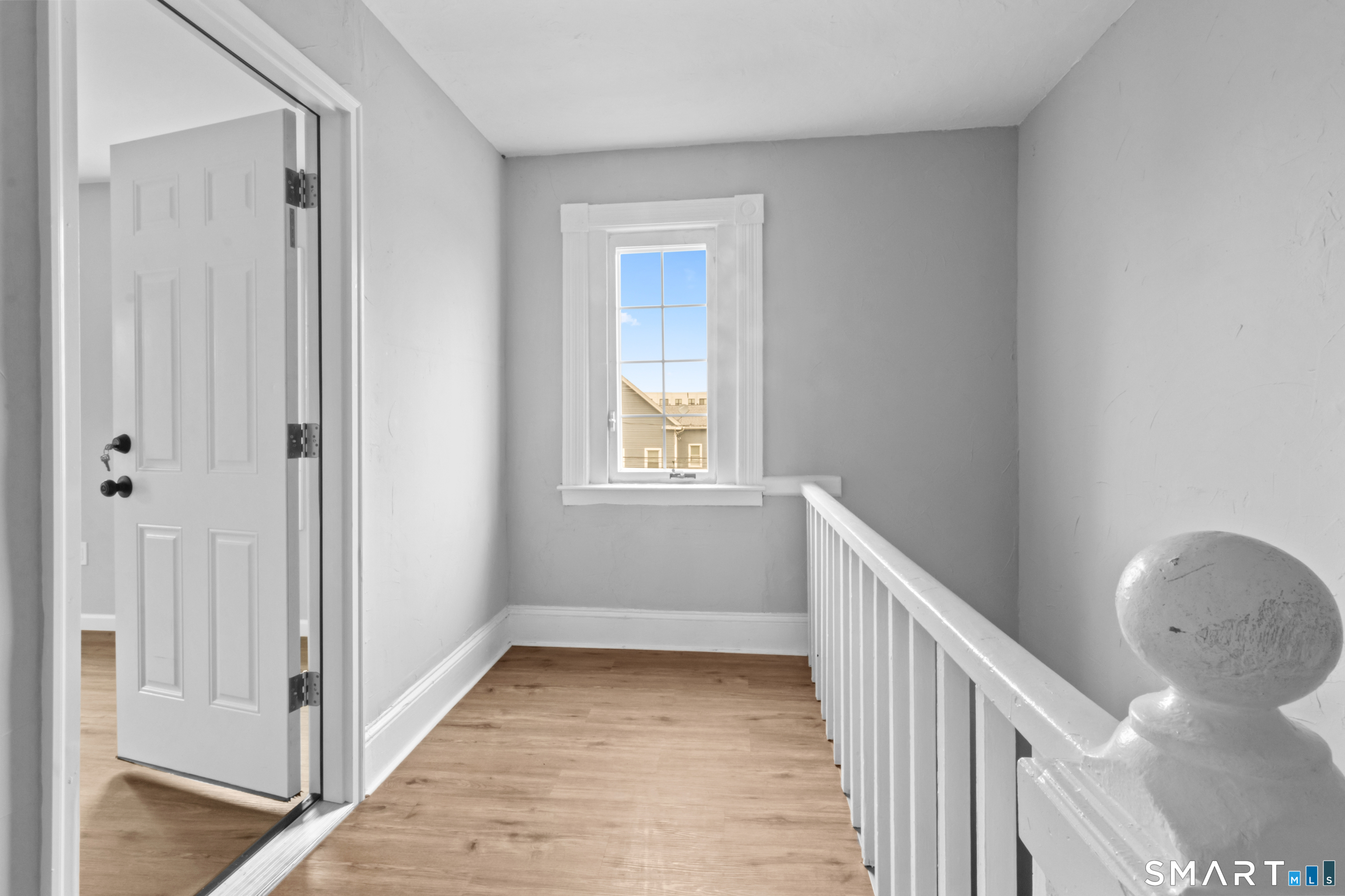 173 Shaw Street New London, CT 06320 - Photo 4 of 19 a view of a hallway with wooden floor and entryway