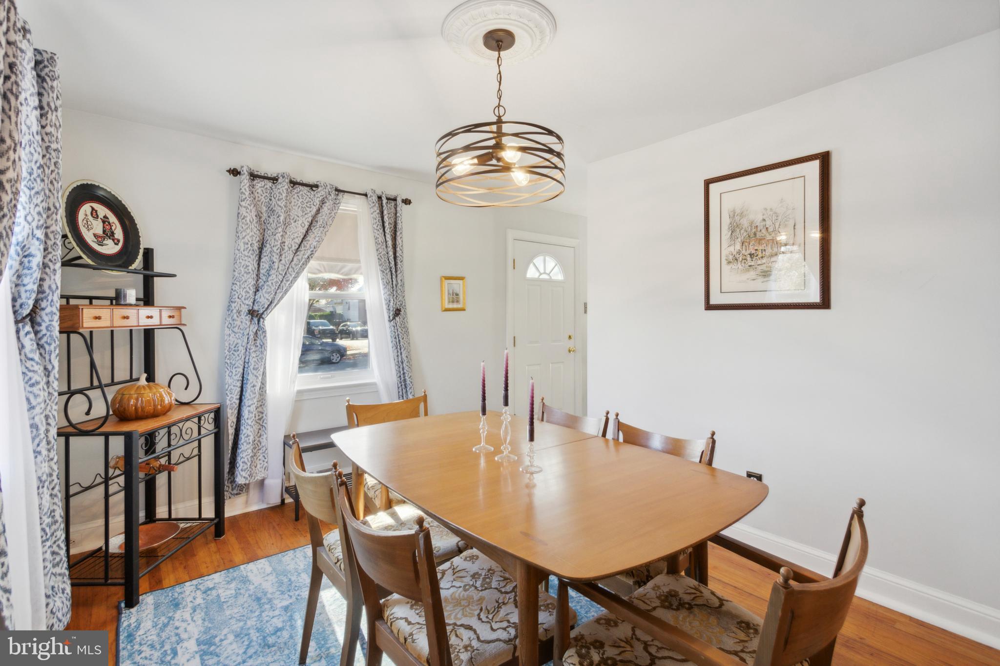 408 Barker Road Springfield, PA 19064 - Photo 11 of 22 a view of a dining room with furniture and wooden floor