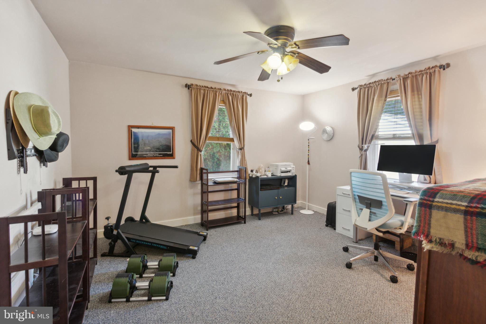 408 Barker Road Springfield, PA 19064 - Photo 14 of 22 a view of a workspace with furniture and a window