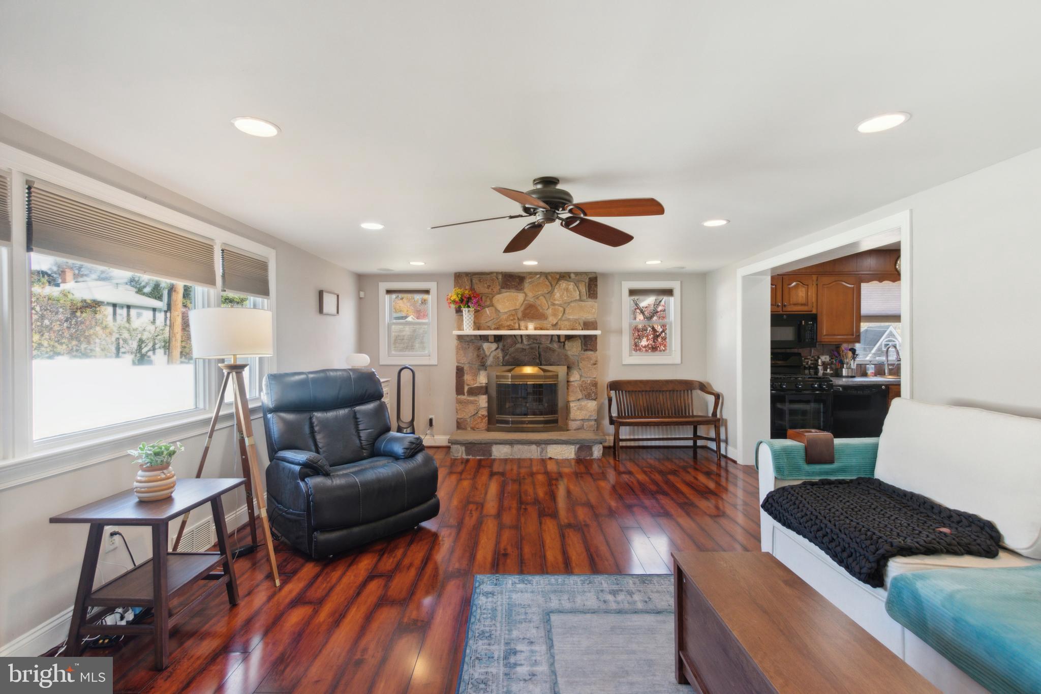 408 Barker Road Springfield, PA 19064 - Photo 15 of 22 a living room with furniture and a fireplace