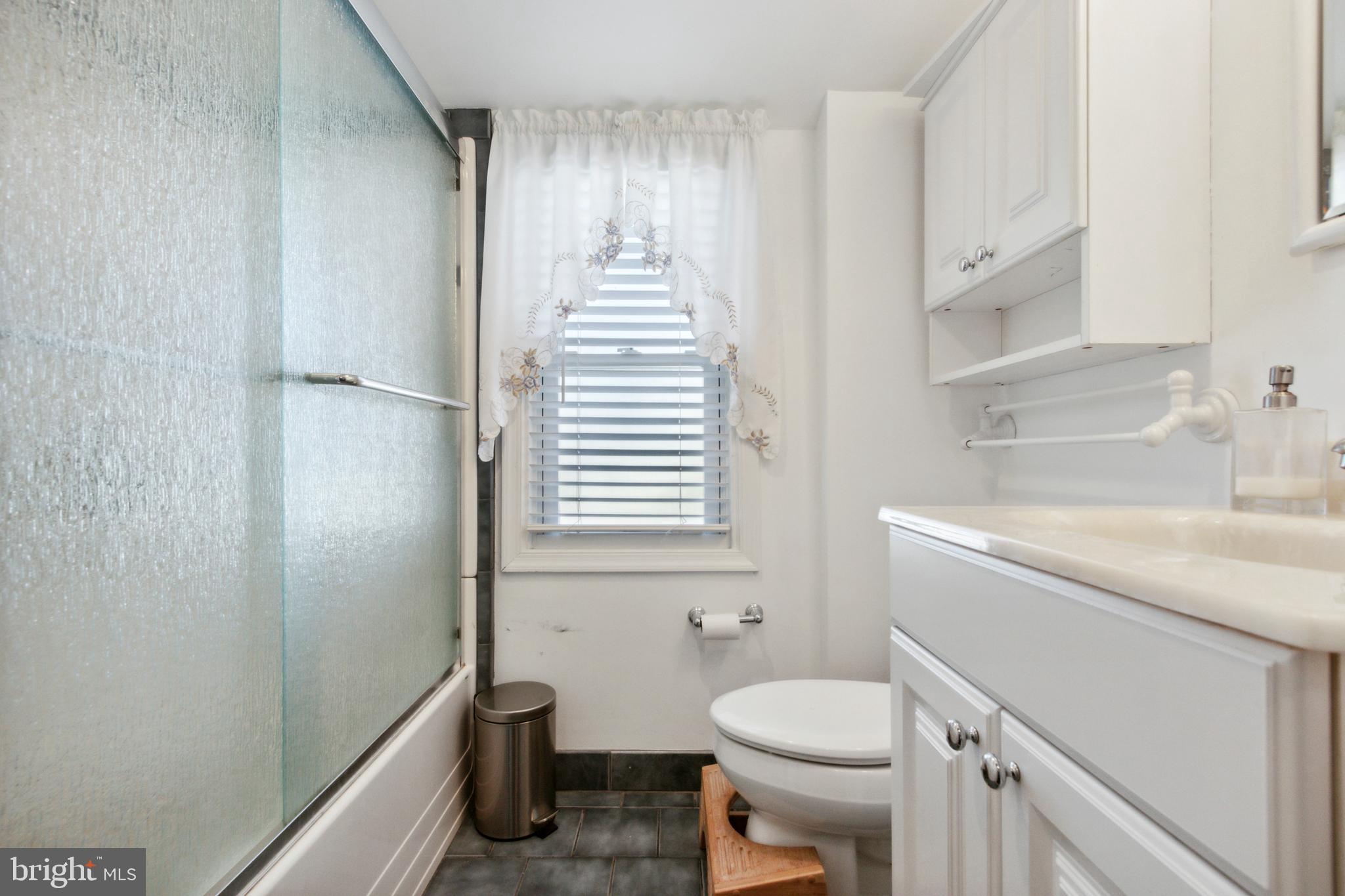 408 Barker Road Springfield, PA 19064 - Photo 18 of 22 a bathroom with a sink toilet and shower