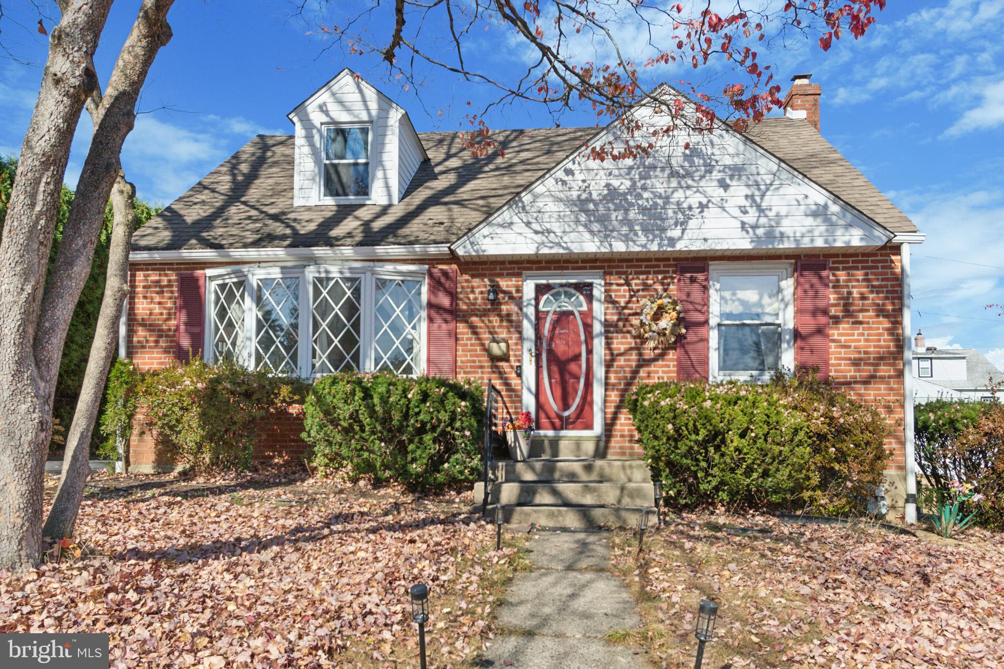 408 Barker Road Springfield, PA 19064 - Photo 2 of 22 a front view of a house with garden