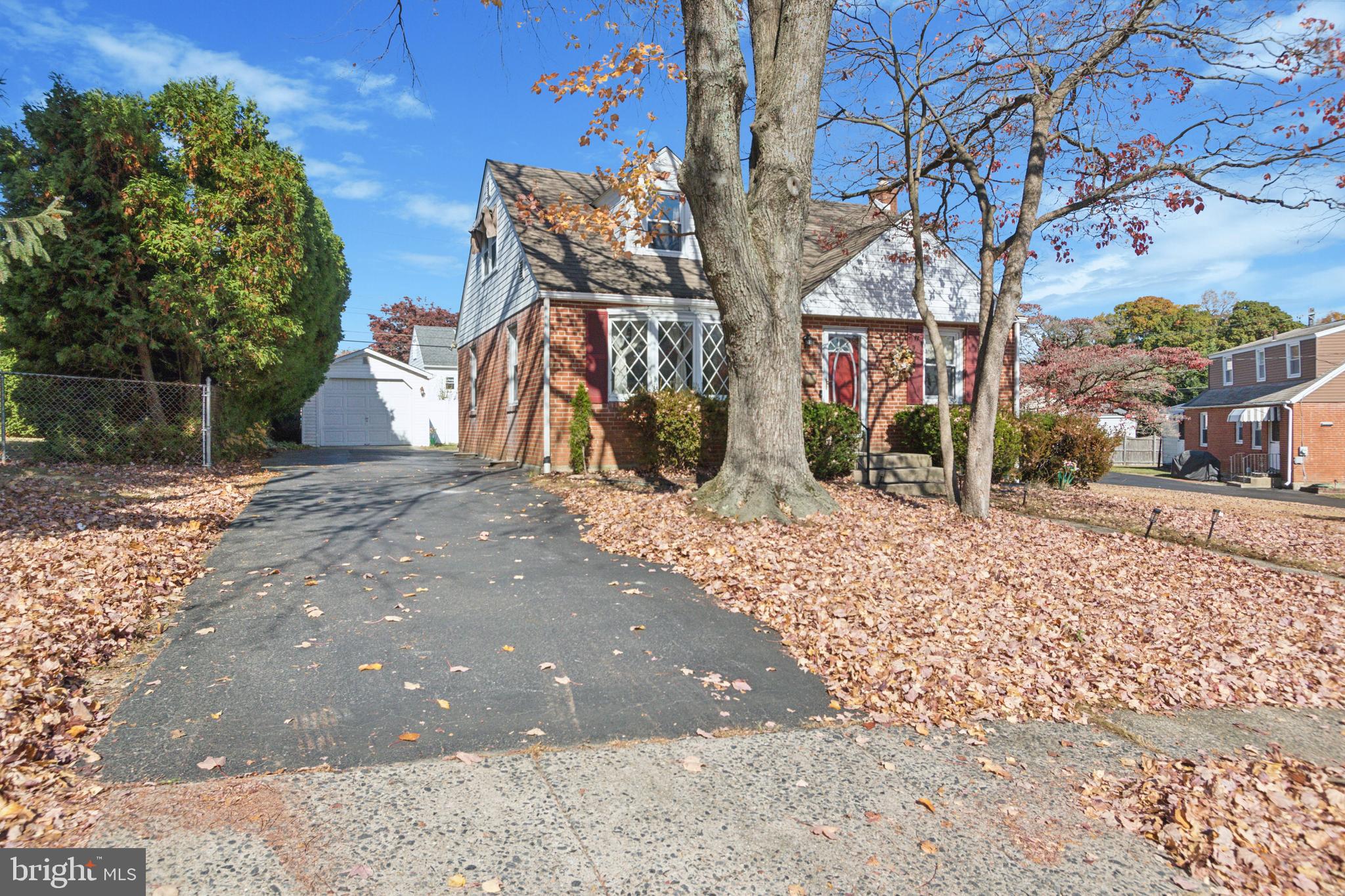 408 Barker Road Springfield, PA 19064 - Photo 21 of 22 a view of road with large trees